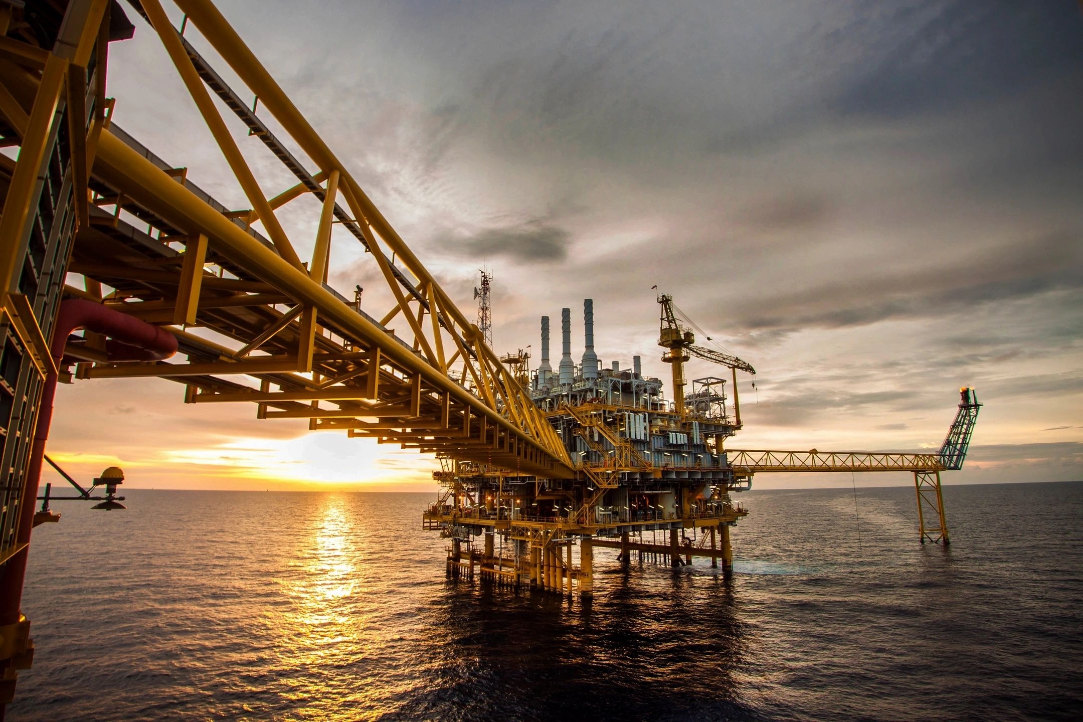 Offshore oil platform at sunset